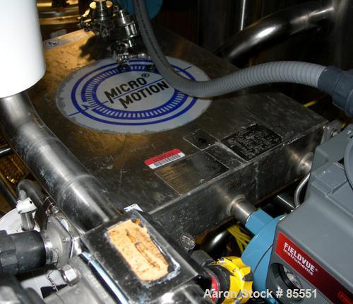 Used Micro Motion Flow Meter, Model DL65S242SU, 316 Stainless Steel Product Contact Areas. Flow cal 20.6984.26, dens flow 11300132894.21. Rated volume 0 to 15 gallons per minute, mass 0 to 125 pounds...