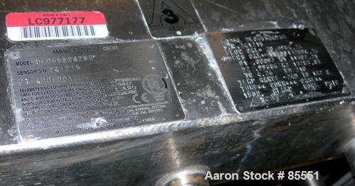 Used Micro Motion Flow Meter, Model DL65S242SU, 316 Stainless Steel Product Contact Areas. Flow cal 20.6984.26, dens flow 11300132894.21. Rated volume 0 to 15 gallons per minute, mass 0 to 125 pounds...