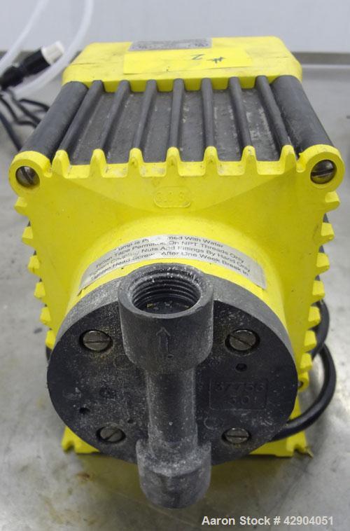 Used LMI Milton Roy Chemical Metering Pump, Model B141-318TI. PVC molded head. Rated 0.007 gallons per minute (7 gallons per hour) at 30 psi. 110-120 volt, connections 0.5” OD tubing.