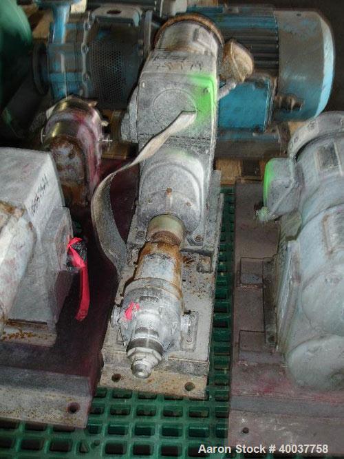 Used Waukesha Roatry Lobe Pump, Model 10, stainless steel construction, 1.5" inlet/outlet, rated 10 GPM, on base with 1 HP 220/440 Volt XP variable speed motor, Serial No. D029058SS.