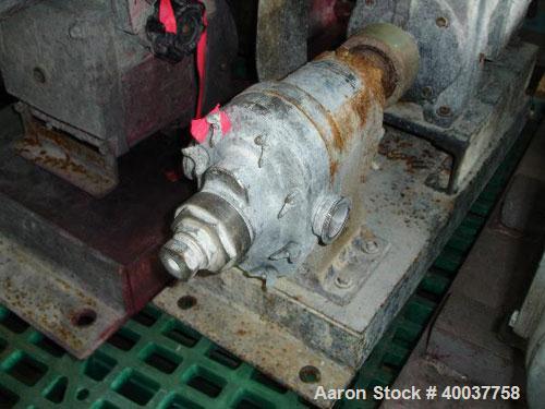 Used Waukesha Roatry Lobe Pump, Model 10, stainless steel construction, 1.5" inlet/outlet, rated 10 GPM, on base with 1 HP 220/440 Volt XP variable speed motor, Serial No. D029058SS.