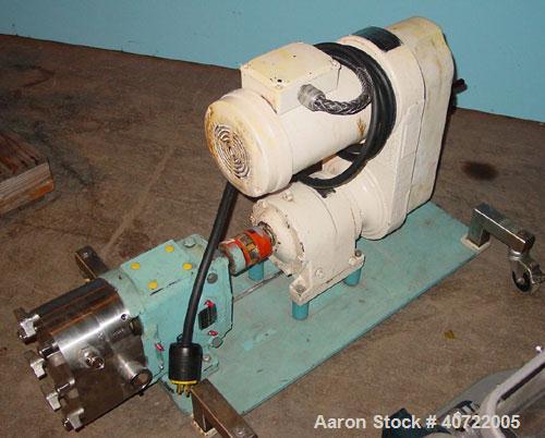 Used Waukesha rotary positive displacement pump, model 30, stainless steel. Approximate capacity 36 gallons per minute at 600 rpm. 1 1/2" tri-clamp inlet/outlet. Jacketed front cover. Driven by a 1 h...