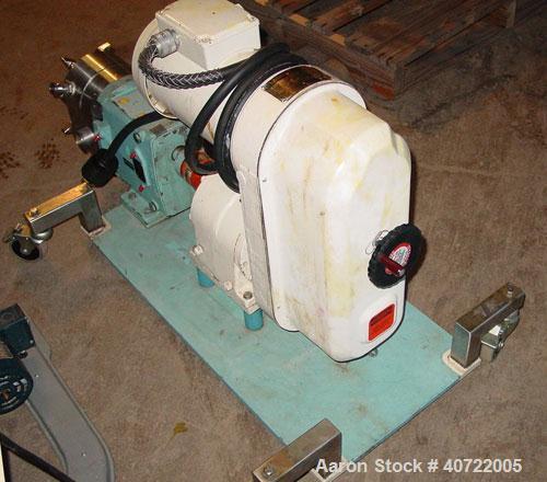 Used Waukesha rotary positive displacement pump, model 30, stainless steel. Approximate capacity 36 gallons per minute at 600 rpm. 1 1/2" tri-clamp inlet/outlet. Jacketed front cover. Driven by a 1 h...
