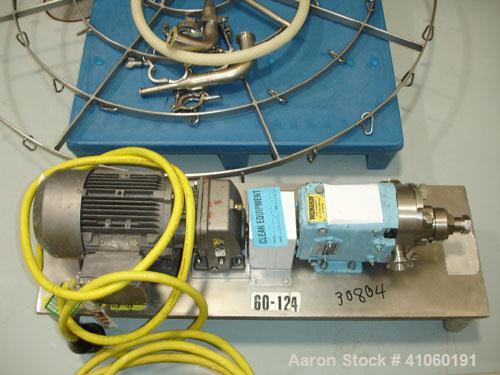 Used Waukesha Rotary Lobe Pump, Model 006. Stainless steel construction, 1.5" inlet/outlet, rated approximately 5 gpm on base with 1.5 hp 230/460 volt motor, serial #122568.