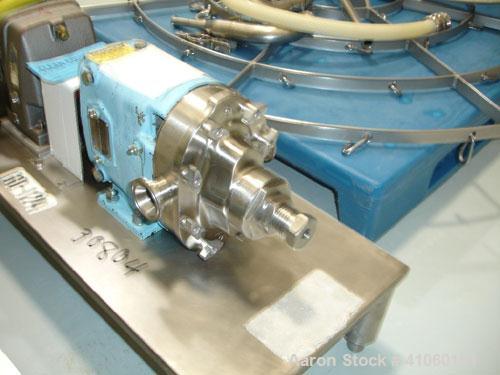 Used Waukesha Rotary Lobe Pump, Model 006. Stainless steel construction, 1.5" inlet/outlet, rated approximately 5 gpm on base with 1.5 hp 230/460 volt motor, serial #122568.