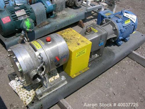 Used APV Rotary Lobe Pump, Type DW4/073/10, Stainless Steel. 3" Inlet & outlet, rated 19.3 gallons per 100 revolutions at 145 psi at 100 degrees C. Driven by a 7.5 hp, 3/60/208-230/460 volt, 1765 rpm...