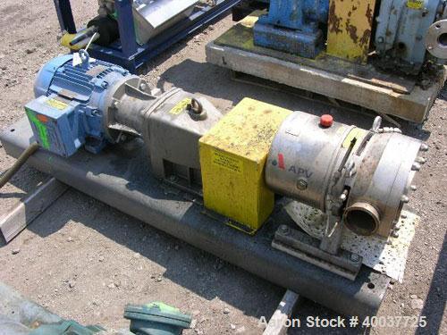 Used APV Rotary Lobe Pump, Type DW4/073/10, Stainless Steel. 3" Inlet & outlet, rated 19.3 gallons per 100 revolutions at 145 psi at 100 degrees C. Driven by a 7.5 hp, 3/60/208-230/460 volt, 1765 rpm...