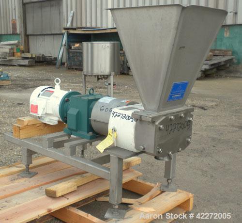 Used APV Rectangular Inlet Top Feed Rotary Positive Displacement Pump, model R6RH, 316 stainless steel. Approximate capacity 150 gallons per minute at 600 rpm. 67.2 cubic inch displacement per revolu...