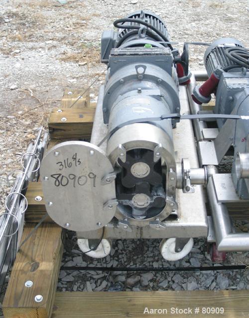 USED:Tri Clover rotary positive displacement pump, model PR125-50M-UC4-SL-S, 316 stainless steel. Approximately 120 gallons per minute at 20 psi. 3-1/2" tri clamp inlet/outlet. (2) 4 lobe rubber roto...