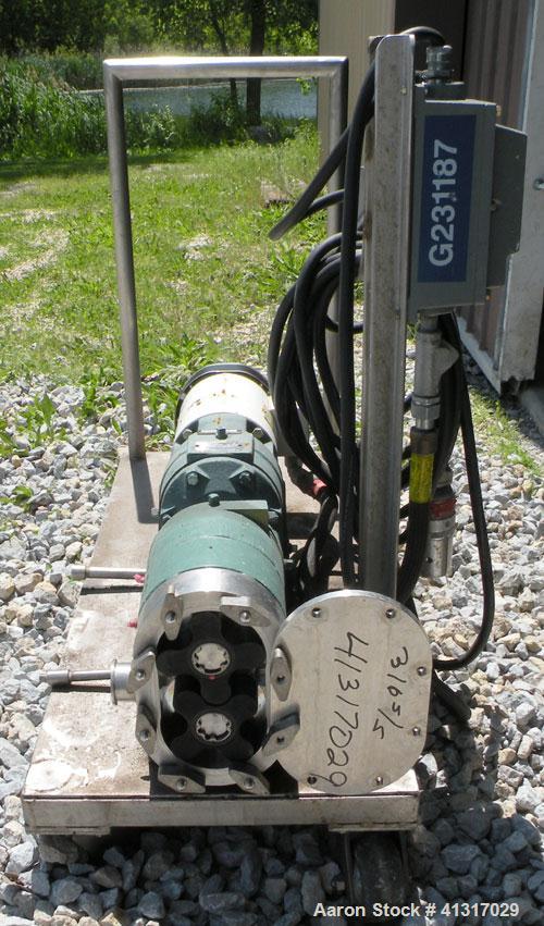 Used Tri-Clover Positive Displacement Pump, 316 Stainless Steel Housing. 1 1/2" tri-clamp inlet/outlet. Rubber rotors. Driven by a 2 hp, 3/60/208-230/460 volt, 1740 rpm motor thru Dodge gear reducer,...
