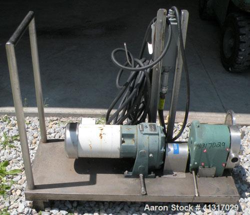 Used Tri-Clover Positive Displacement Pump, 316 Stainless Steel Housing. 1 1/2" tri-clamp inlet/outlet. Rubber rotors. Driven by a 2 hp, 3/60/208-230/460 volt, 1740 rpm motor thru Dodge gear reducer,...