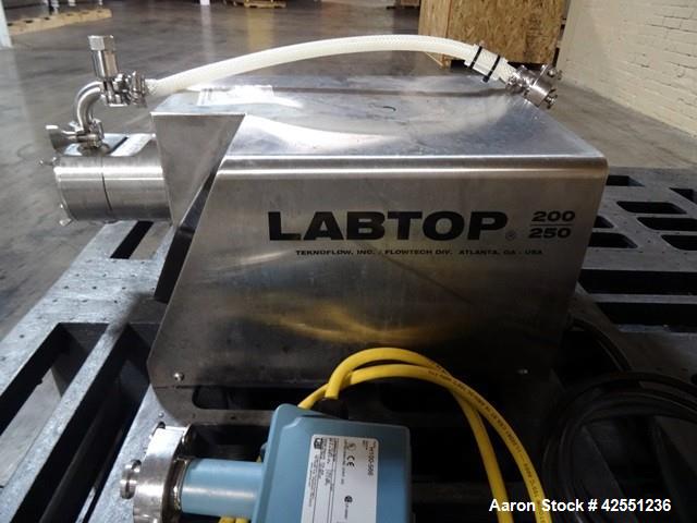 Used Unibloc PD Labtop Rotary Lobe Pump, Model 250, Stainless Steel. Has polyflex plastic rotors, 1" inlet/outlet. Approximately 8 gpm with integrally motor with vfd controller. 104-126 volt. Serial#...