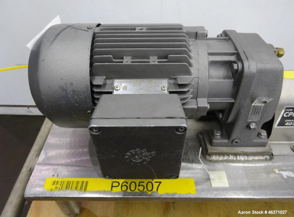 Used Waukesha Rotary Positive Displacement Pump, Model 006, 316 Stainless Steel. Approximately 6 gallons per minute at 200 psi at 800 rpm capacity, (.0082) gallon displacement per revolution. 1" Tri-...