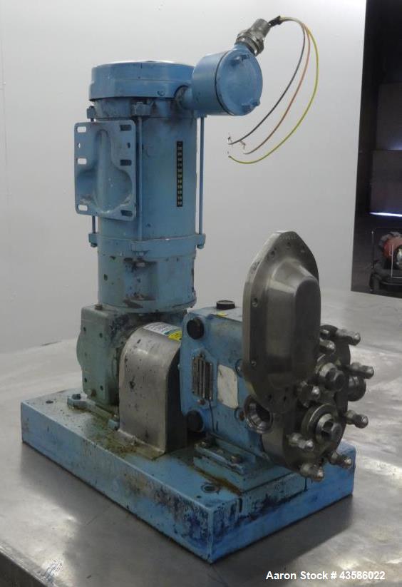 Used Waukesha Positive Displacement Pump, Model 015U2AP, 316 Stainless Steel. 1-1/2" Tri-clamp inlet/outlet, (2) stainless steel rotors. Driven  by a 1-1/2 hp, 3/60/230/460 volt, 1740 rpm XP gear mot...