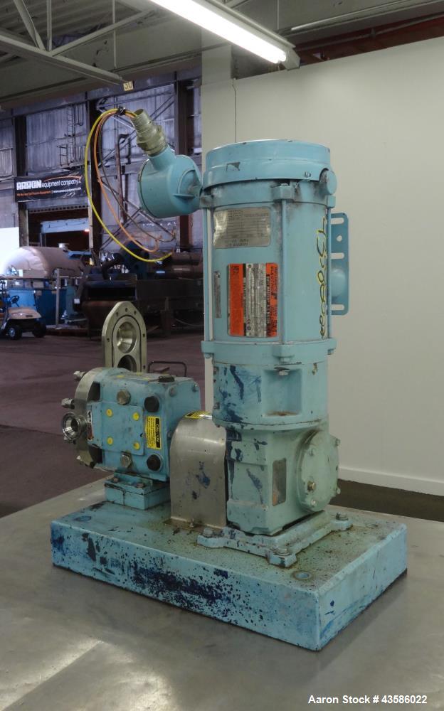 Used Waukesha Positive Displacement Pump, Model 015U2AP, 316 Stainless Steel. 1-1/2" Tri-clamp inlet/outlet, (2) stainless steel rotors. Driven  by a 1-1/2 hp, 3/60/230/460 volt, 1740 rpm XP gear mot...