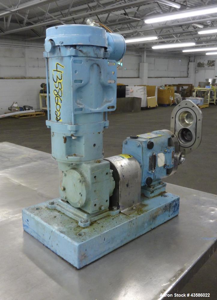Used Waukesha Positive Displacement Pump, Model 015U2AP, 316 Stainless Steel. 1-1/2" Tri-clamp inlet/outlet, (2) stainless steel rotors. Driven  by a 1-1/2 hp, 3/60/230/460 volt, 1740 rpm XP gear mot...