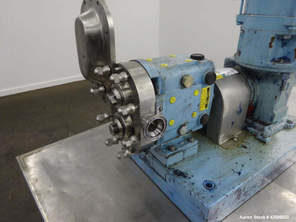 Used Waukesha Positive Displacement Pump, Model 015U2AP, 316 Stainless Steel. 1-1/2" Tri-clamp inlet/outlet, (2) stainless steel rotors. Driven  by a 1-1/2 hp, 3/60/230/460 volt, 1740 rpm XP gear mot...