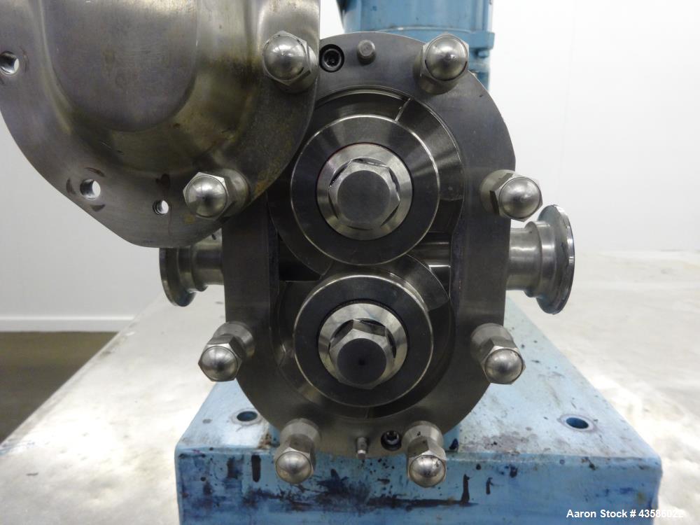 Used Waukesha Positive Displacement Pump, Model 015U2AP, 316 Stainless Steel. 1-1/2" Tri-clamp inlet/outlet, (2) stainless steel rotors. Driven  by a 1-1/2 hp, 3/60/230/460 volt, 1740 rpm XP gear mot...