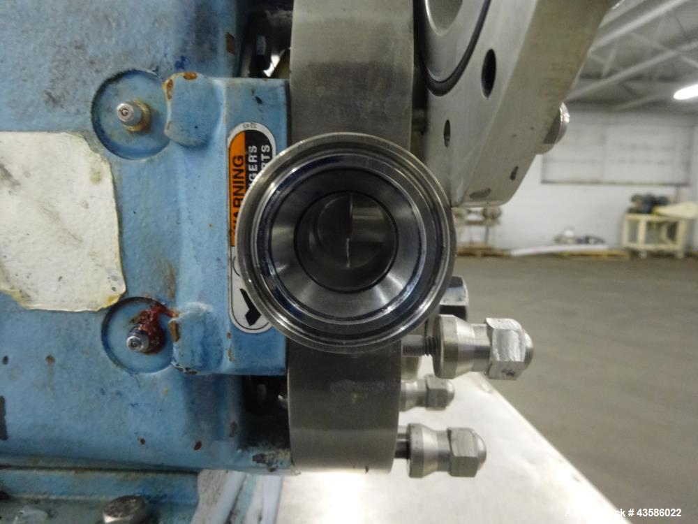 Used Waukesha Positive Displacement Pump, Model 015U2AP, 316 Stainless Steel. 1-1/2" Tri-clamp inlet/outlet, (2) stainless steel rotors. Driven  by a 1-1/2 hp, 3/60/230/460 volt, 1740 rpm XP gear mot...