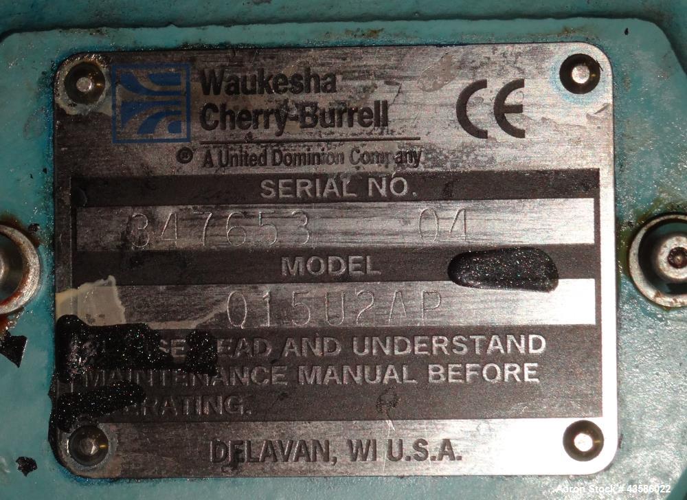 Used Waukesha Positive Displacement Pump, Model 015U2AP, 316 Stainless Steel. 1-1/2" Tri-clamp inlet/outlet, (2) stainless steel rotors. Driven  by a 1-1/2 hp, 3/60/230/460 volt, 1740 rpm XP gear mot...