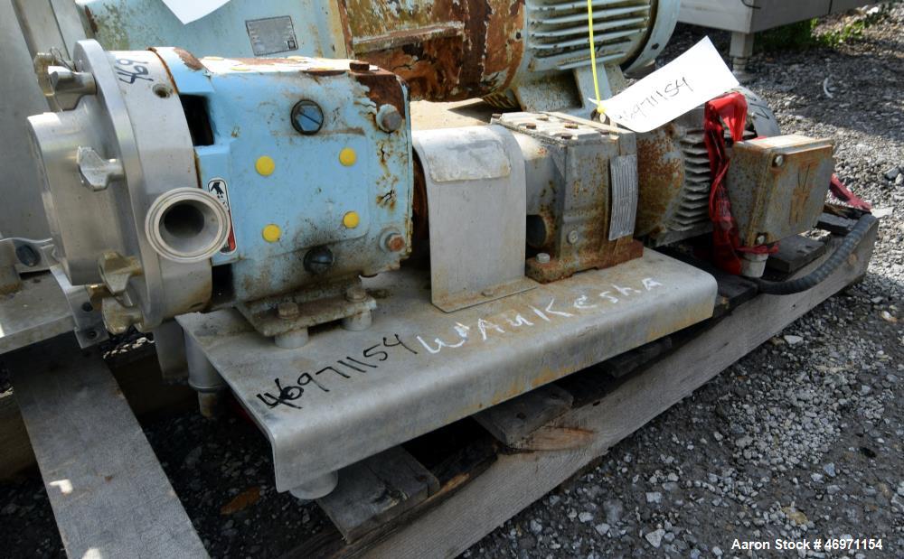 Used Waukesha Positive Displacement Pump, Model 015, 316 Stainless Steel. Approximate displacement 0.142 gallons per revolution, nominal capacity to 9 gallons per minute. Driven by a 2hp, 3/60/230/46...