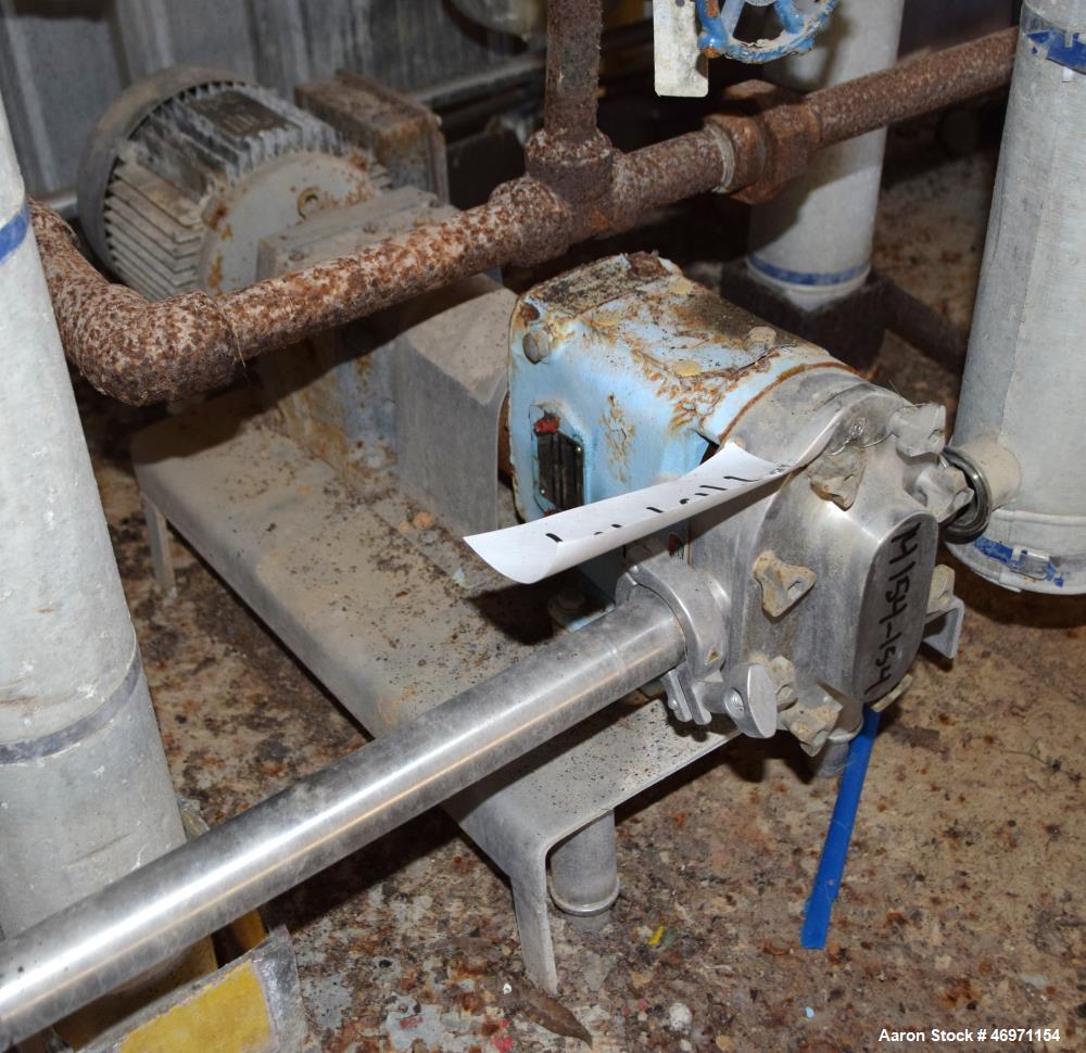 Used Waukesha Positive Displacement Pump, Model 015, 316 Stainless Steel. Approximate displacement 0.142 gallons per revolution, nominal capacity to 9 gallons per minute. Driven by a 2hp, 3/60/230/46...