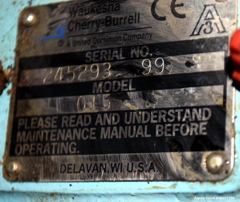 Used Waukesha Positive Displacement Pump, Model 015, 316 Stainless Steel. Approximate displacement 0.142 gallons per revolution, nominal capacity to 9 gallons per minute. Driven by a 2hp, 3/60/230/46...