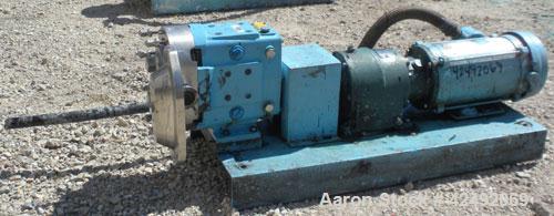 Used Waukesha Rotary Positive Displacement Pump, Model 030U2AP, 316 Stainless Steel. Approximately 36 gallons per minute at 100 psi at 600 rpm capacity, .06 gallon displacement per revolution. 1-1/2"...
