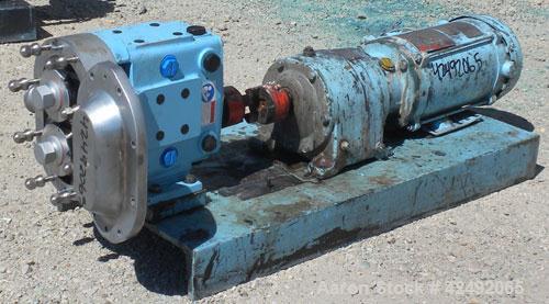 Used Waukesha Rotary Positive Displacement Pump, Model 030U2, 316 Stainless Steel. Approximately 36 gallons per minute at 100 psi at 600 rpm capacity, (.06) gallon displacement per revolution. 1-1/2"...