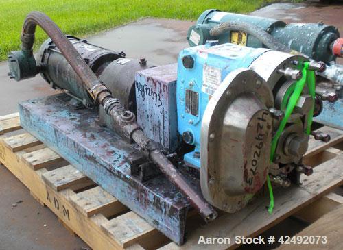 Used Waukesha Rotary Positive Displacement Pump, Model 030U2, 316 Stainless Steel. Approximately 36 gallons per minute at 100 psi at 600 rpm capacity, (.06) gallon displacement per revolution. 1-1/2"...
