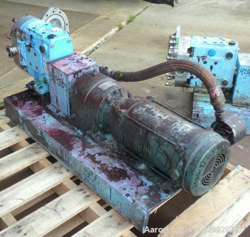 Used Waukesha Rotary Positive Displacement Pump, Model 030U2, 316 Stainless Steel. Approximately 36 gallons per minute at 100 psi at 600 rpm capacity, (.06) gallon displacement per revolution. 1-1/2"...