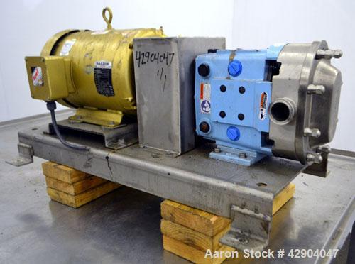 Used Waukesha Universal 2 Rotary Positive Displacement Pump, Model 030U2, 316 Stainless Steel. Approximate capacity 36 gallons per minute 200 psi at 600 rpm. (.060) Gallon displacement per revolution...