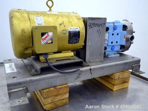 Used Waukesha Universal 2 Rotary Positive Displacement Pump, Model 030U2, 316 Stainless Steel. Approximate capacity 36 gallons per minute 200 psi at 600 rpm. (.060) Gallon displacement per revolution...