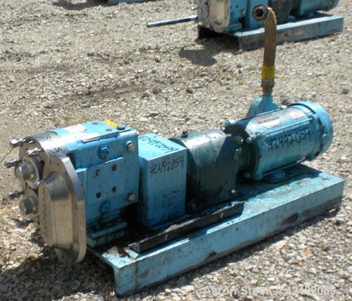 Used Waukesha Rotary Positive Displacement Pump, Model 030US-AP, 316 Stainless Steel. Approximately 36 gallons per minute at 100 psi at 600 rpm capacity, .06 gallon displacement per revolution. 1-1/2...