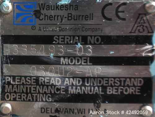 Used Waukesha Rotary Positive Displacement Pump, Model 030US-AP, 316 Stainless Steel. Approximately 36 gallons per minute at 100 psi at 600 rpm capacity, .06 gallon displacement per revolution. 1-1/2...