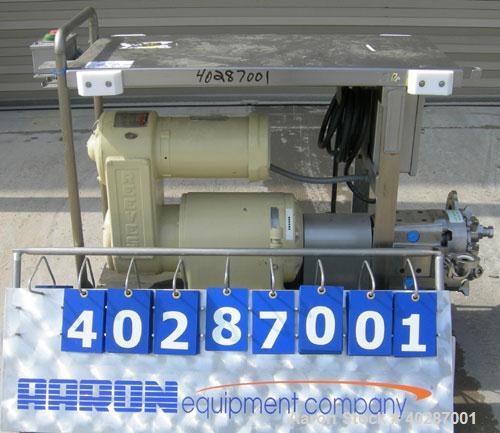 Used Waukesha Cherry Burrell positive displacement pump, model 030, 316 stainless steel. Approximate capacity 36 gallons per minute at 600 rpm. 1 1/2" triclamp inlet/outlet.  (2) stainless steel roto...