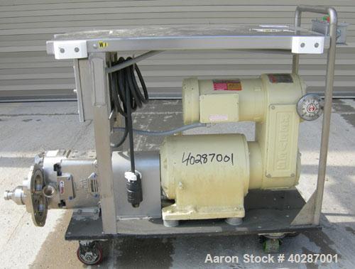 Used Waukesha Cherry Burrell positive displacement pump, model 030, 316 stainless steel. Approximate capacity 36 gallons per minute at 600 rpm. 1 1/2" triclamp inlet/outlet.  (2) stainless steel roto...