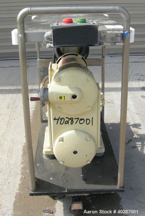 Used Waukesha Cherry Burrell positive displacement pump, model 030, 316 stainless steel. Approximate capacity 36 gallons per minute at 600 rpm. 1 1/2" triclamp inlet/outlet.  (2) stainless steel roto...