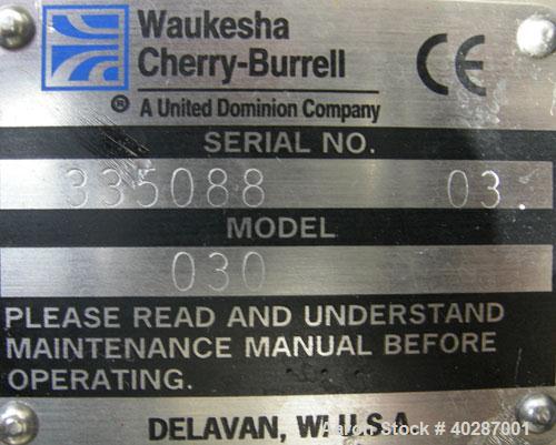 Used Waukesha Cherry Burrell positive displacement pump, model 030, 316 stainless steel. Approximate capacity 36 gallons per minute at 600 rpm. 1 1/2" triclamp inlet/outlet.  (2) stainless steel roto...