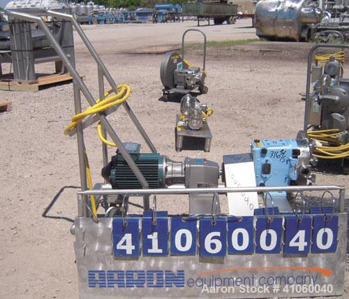 Used Waukesha Rotary Positive Displacement Pump, Model 030, 316 Stainless Steel. Approximately 36 gallons per minute at 100 psi at 600 rpm capacity, (.06) gallon displacement per revolution. 1 1/2" t...