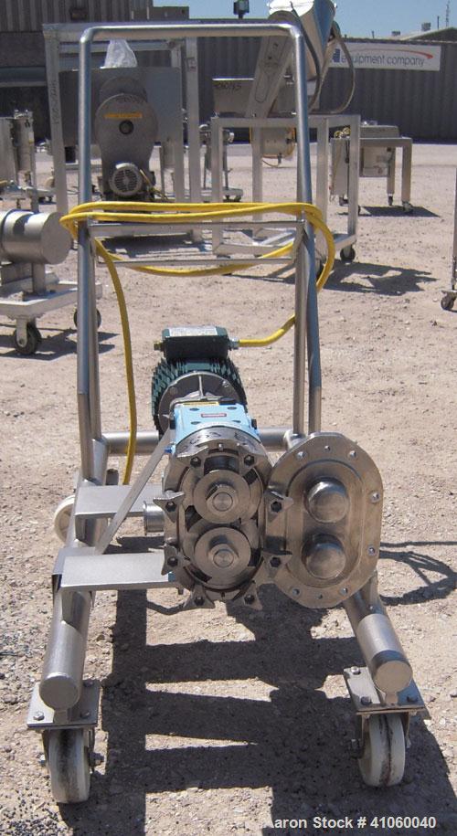Used Waukesha Rotary Positive Displacement Pump, Model 030, 316 Stainless Steel. Approximately 36 gallons per minute at 100 psi at 600 rpm capacity, (.06) gallon displacement per revolution. 1 1/2" t...