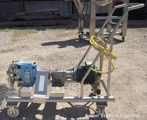 Used Waukesha Rotary Positive Displacement Pump, Model 030, 316 Stainless Steel. Approximately 36 gallons per minute at 100 psi at 600 rpm capacity, (.06) gallon displacement per revolution. 1 1/2" t...