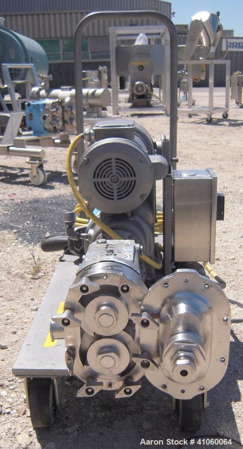 Used Waukesha Rotary Positive Displacement Pump, Model 030, 316 Stainless Steel. Approximately 36 gallons per minute at 100 psi at 600 rpm capacity, .06 gallon displacement per revolution. 1 1/2" tri...