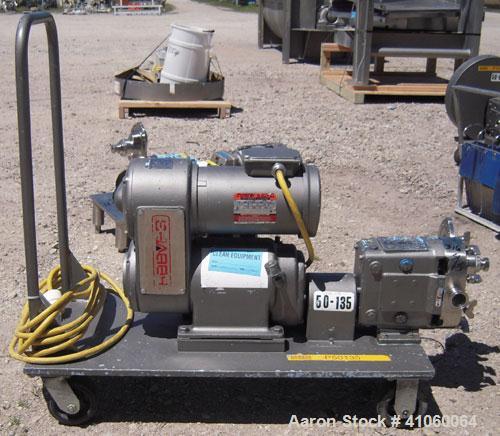 Used Waukesha Rotary Positive Displacement Pump, Model 030, 316 Stainless Steel. Approximately 36 gallons per minute at 100 psi at 600 rpm capacity, .06 gallon displacement per revolution. 1 1/2" tri...