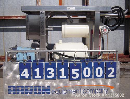 Used Waukesha Rotary Positive Displacement Pump, model 030, 316 stainless steel. Approximately 36 gallons per minute at 100 psi at 600 rpm capacity, .06 gallon displacement per revolution. 1 1/2" tri...