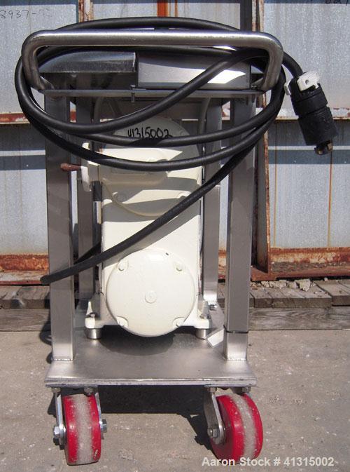 Used Waukesha Rotary Positive Displacement Pump, model 030, 316 stainless steel. Approximately 36 gallons per minute at 100 psi at 600 rpm capacity, .06 gallon displacement per revolution. 1 1/2" tri...