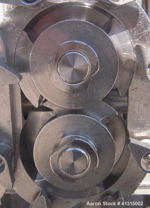 Used Waukesha Rotary Positive Displacement Pump, model 030, 316 stainless steel. Approximately 36 gallons per minute at 100 psi at 600 rpm capacity, .06 gallon displacement per revolution. 1 1/2" tri...