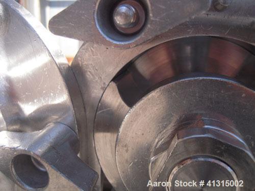 Used Waukesha Rotary Positive Displacement Pump, model 030, 316 stainless steel. Approximately 36 gallons per minute at 100 psi at 600 rpm capacity, .06 gallon displacement per revolution. 1 1/2" tri...