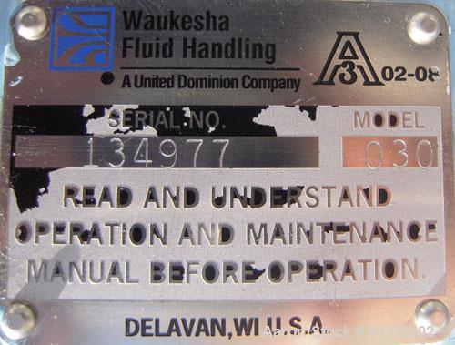 Used Waukesha Rotary Positive Displacement Pump, model 030, 316 stainless steel. Approximately 36 gallons per minute at 100 psi at 600 rpm capacity, .06 gallon displacement per revolution. 1 1/2" tri...