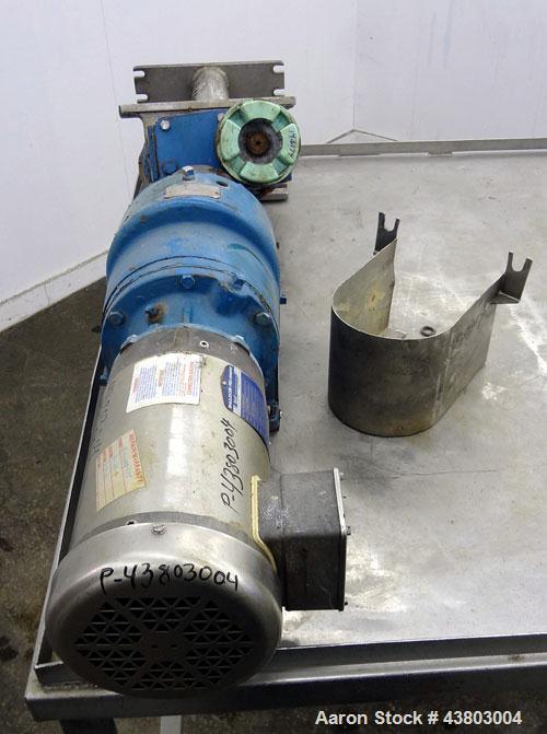 Used Waukesha Rectangular Flange Universal Rotary Positive Displacement Pump, Model 034, 316 Stainless Steel. Approximately 24 gallons per minute at 200 psi at 400 rpm, (0.060) gallon displacement pe...